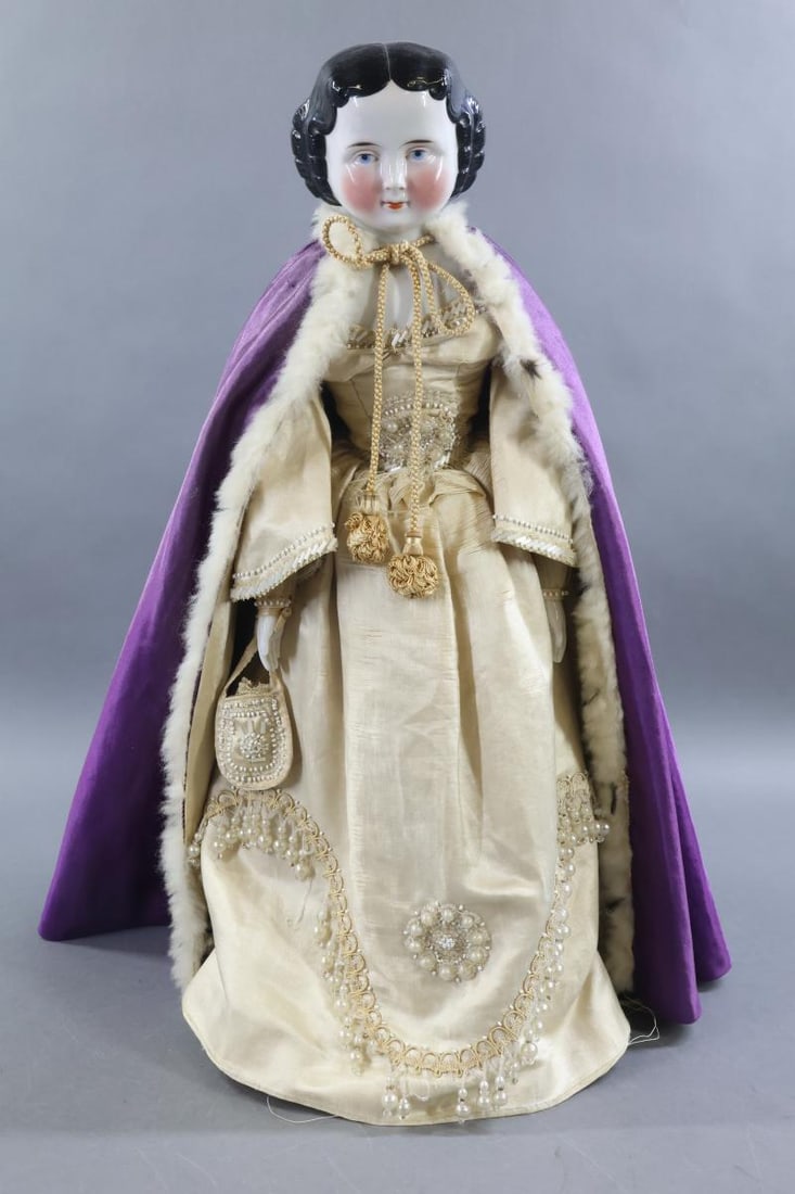 CHINA DOLLS.: 23" 1860's-1870's Doll with black center part flat top hair style, painted blue eyes, rosey cheeks. Cloth body with china lower arms. Dressed in all antique clothing. Ivory silk satin dress with