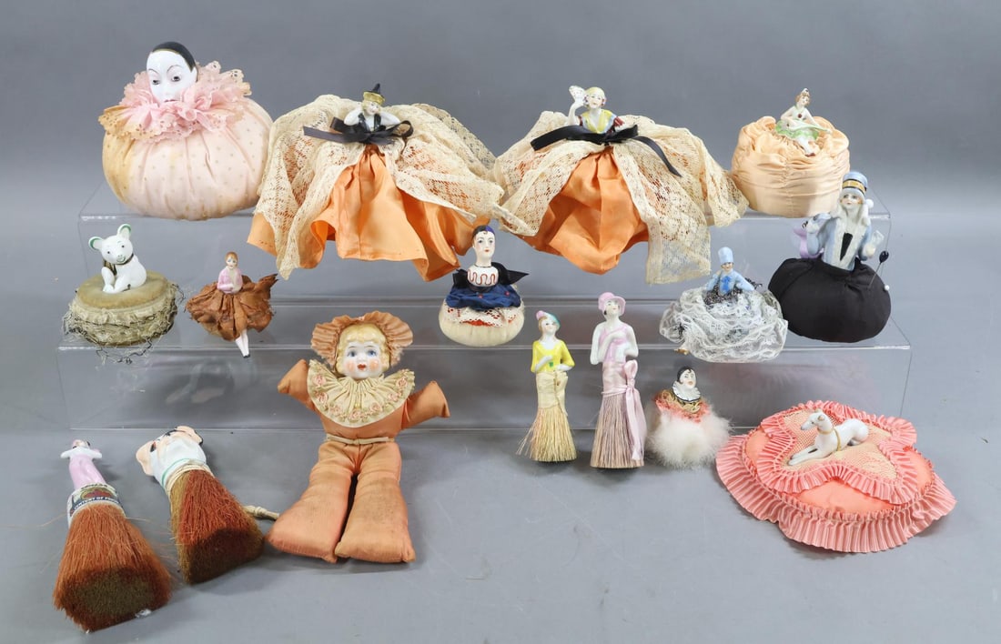 CHINA DOLLS/NOVELTIES.: LOT. (4) China mounted whisk brushes inc. (3) HALF dolls and a German DOG. (1) German Doll reads: Chicago, 1833 - 1933 Century of Progress. 8" Pin cushion doll with China head. DOG mounted on a