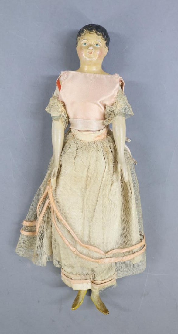 PAPIER MACHE DOLLS.: 14" German "Milliner's Model" doll. Unretouched shoulder head, painted short black curly hair, blue eyes. Leather body, wooden arms and legs. Painted yellow shoes. Dressed in all antique clothing -