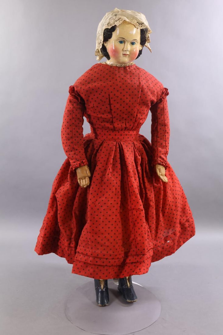 PAPIER MACHE DOLLS.: 30" Unmarked shoulder head doll with black center part hair, painted blue eyes, rosey cheeks. Very nice face coloring. She has a very deep shoulder plate. Cloth body is stamped "11" on back. Camel