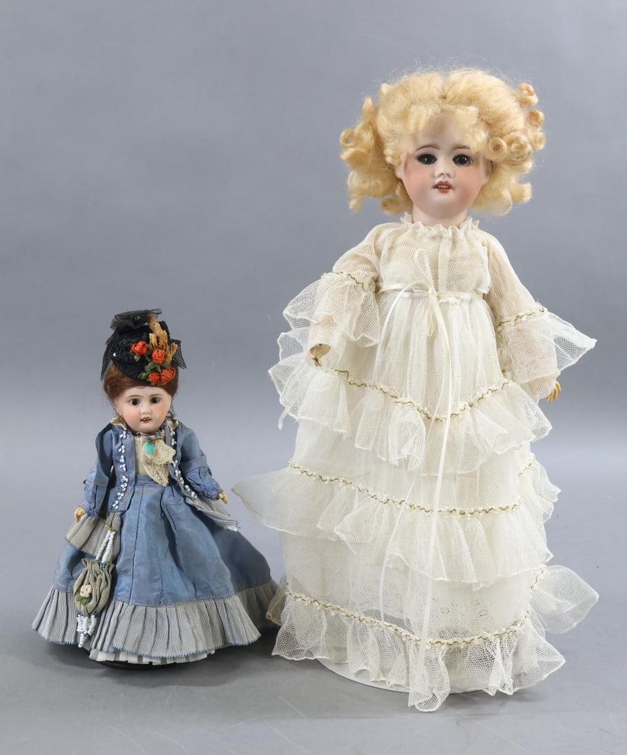 FRENCH BISQUE DOLLS.: Pair of dolls. Both dolls have open mouths, mohair wigs, papier mache bodies. (2) Stands. Doll 1) 8" J (anchor symbol)V 3/0 with stationary black eyes, brown wig. 5 Pc. body with painted shoes,
