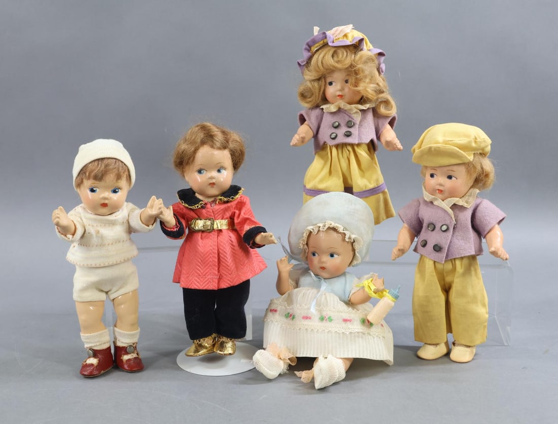 1940's - 1960's DOLLS.: LOT of (5) composition VOGUE 1937 - 1948 dolls. All of these dolls have painted side glance eyes, closed mouths and are dressed in factory original clothing. 8" Set of "Jack & Jill". Jill's shoe is