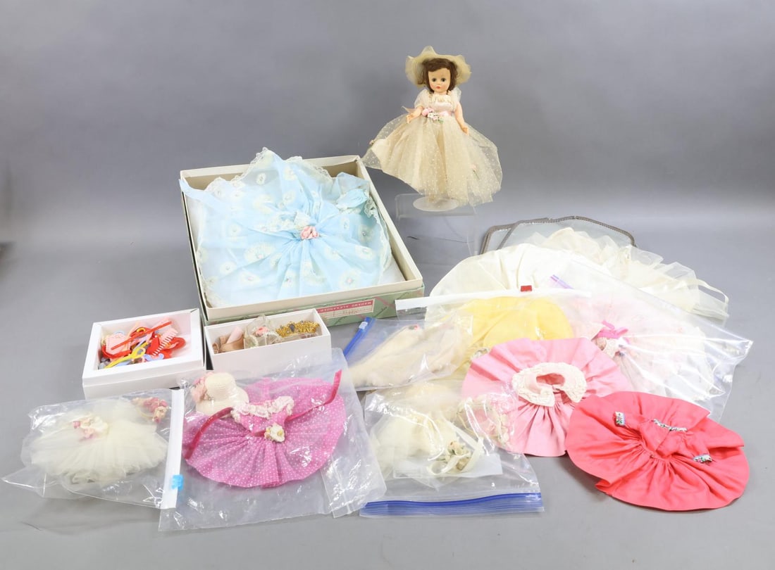 1940's - 1960's DOLLS.: LOT. 10 1/2" 1959-1963 MADAME ALEXANDER "Cissette" doll with original tagged wardrobe. This is a wonderful ensemble. Brunette doll with pale pink eyelids, single stroke eyebrows, high heel feet,
