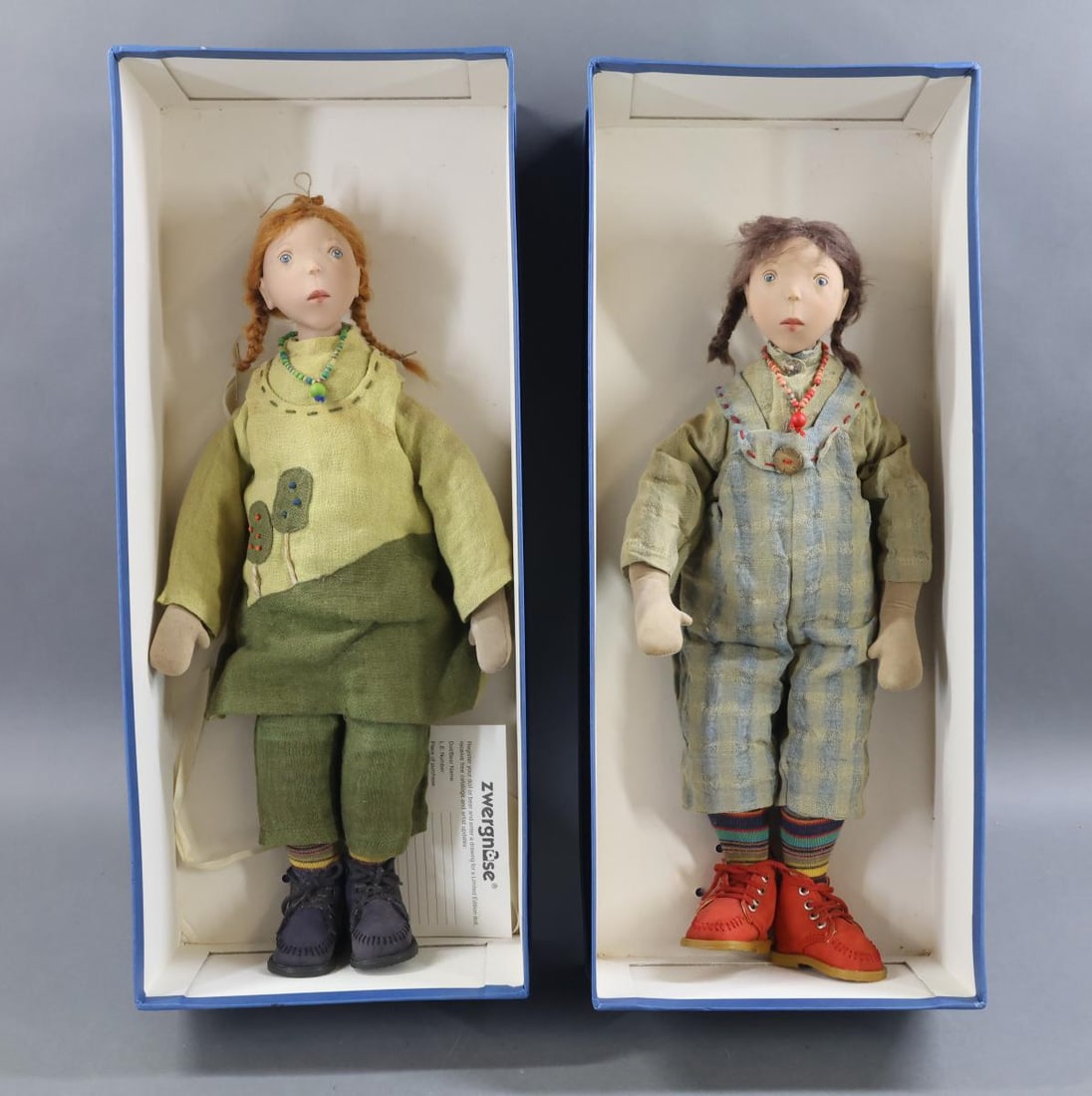 CONTEMPORARY ARTIST DOLLS.: Pair of 2000 ZWERGNASE 18" Sister dolls in original boxes. Both of these dolls have vinyl heads with mohair wigs. Suede cloth bodies, mitt hands. They were made in a Ltd. Ed. of 250. "Winnyfred" with 