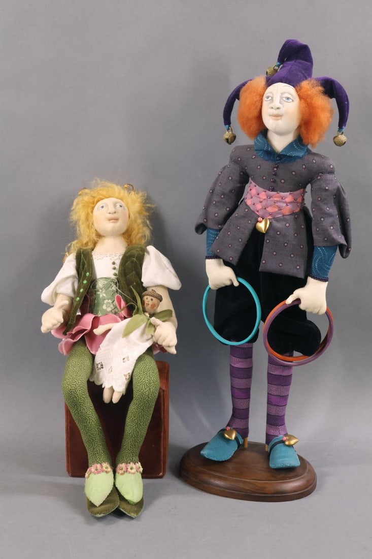 CONTEMPORARY ARTIST DOLLS.: Pair of cloth character dolls by artist AKIRA BLOUNT. Tagged and signed 14" 1992 "Fairy and Baby". Baby's head is a painted acorn. 17 1/2" Signed 1993 "Jester" on a wooden base. The detail and