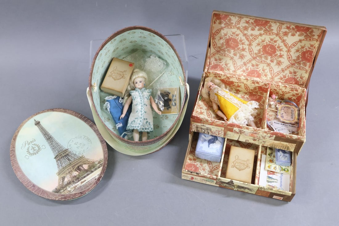 CONTEMPORARY ARTIST DOLLS.: LOT. Pair of all bisque "Mignonette" dolls. 5 1/2" Doll with blue glass eyes marked 1997 SCS S475. Flaxen mohair wig, pierced ears. 5 Pc. body with swivel head. She comes with (2) dresses and (2)