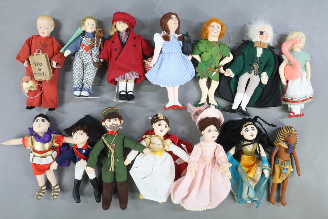 ARTIST DOLLS/MINIATURES.: LOT. Pair of Jane Davies dolls - boy & girl dolls from the Deb Canham Series. 5 1/2" Tagged Charlie Calico 131/500 and 5 1/2" unnamed girl. Set of (4) Cloth 6 1/2" Characters signed by artist Gladys
