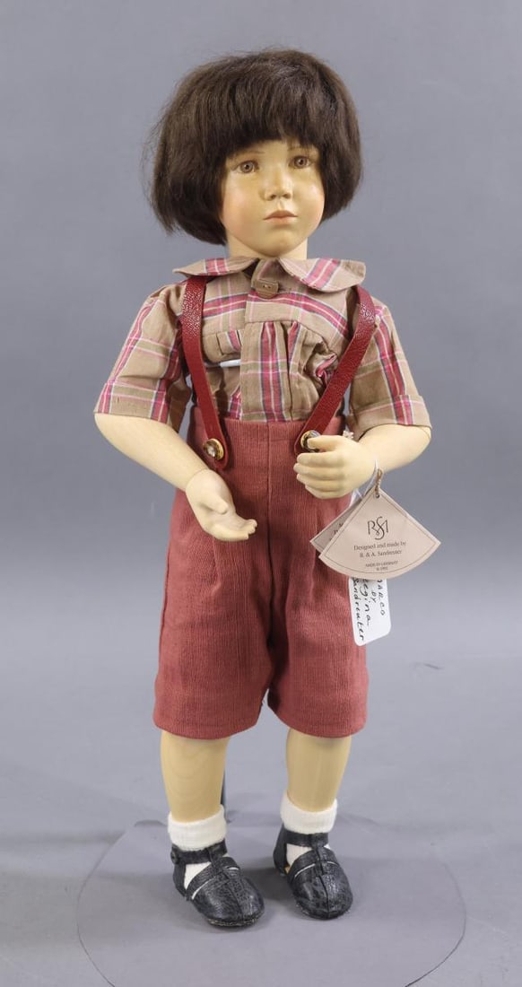 ARTIST DOLLS.: 18" 1993 handcrafted wooden "Marco" by German artist Regina Sandreuter. Ltd. Ed. 37/50. Hang tag reads: the all wood Multipose Body has (12) joints. Painted brown intaglio eyes, closed mouth, dark