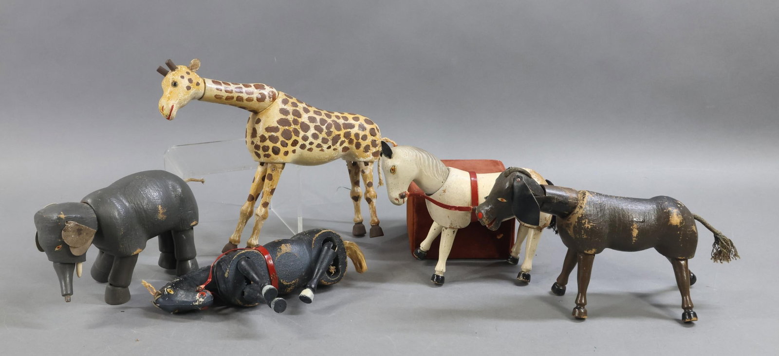 SCHOENHUT.: LOT of (5) SCHOENHUT Circus animals. Donkey with painted eyes. Black Horse with painted eyes (missing (1) leg). White Horse with painted eyes. Reduced size Elephant with painted eyes (missing end of
