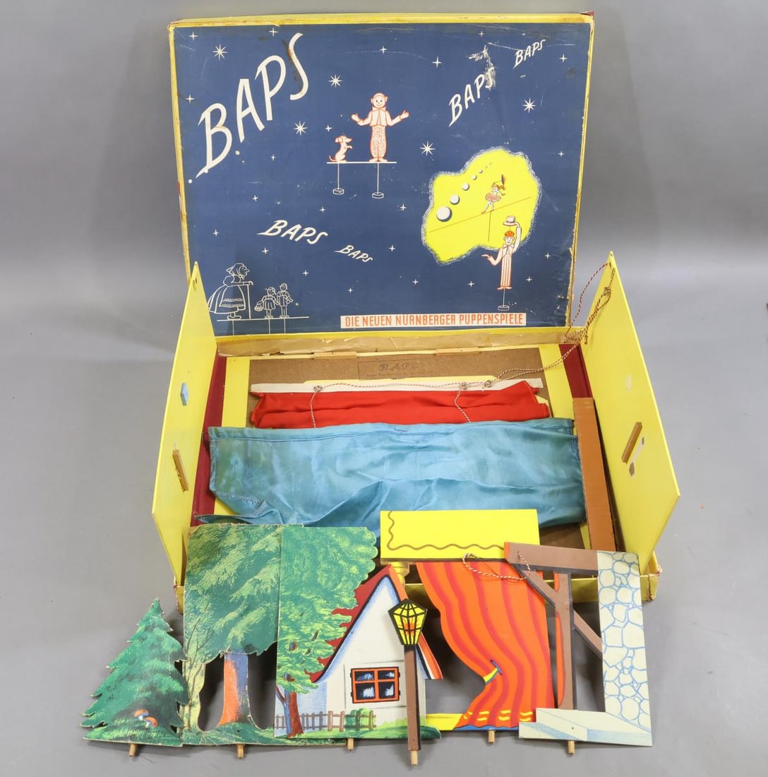 BAPS.: LOT. BAPS Stage/puppet theatre in original box. (May not be complete.) Figures include - (17) people. (6) Animals include - duck, dragons, seal, bear, rabbit. These are all weighted pieces. They