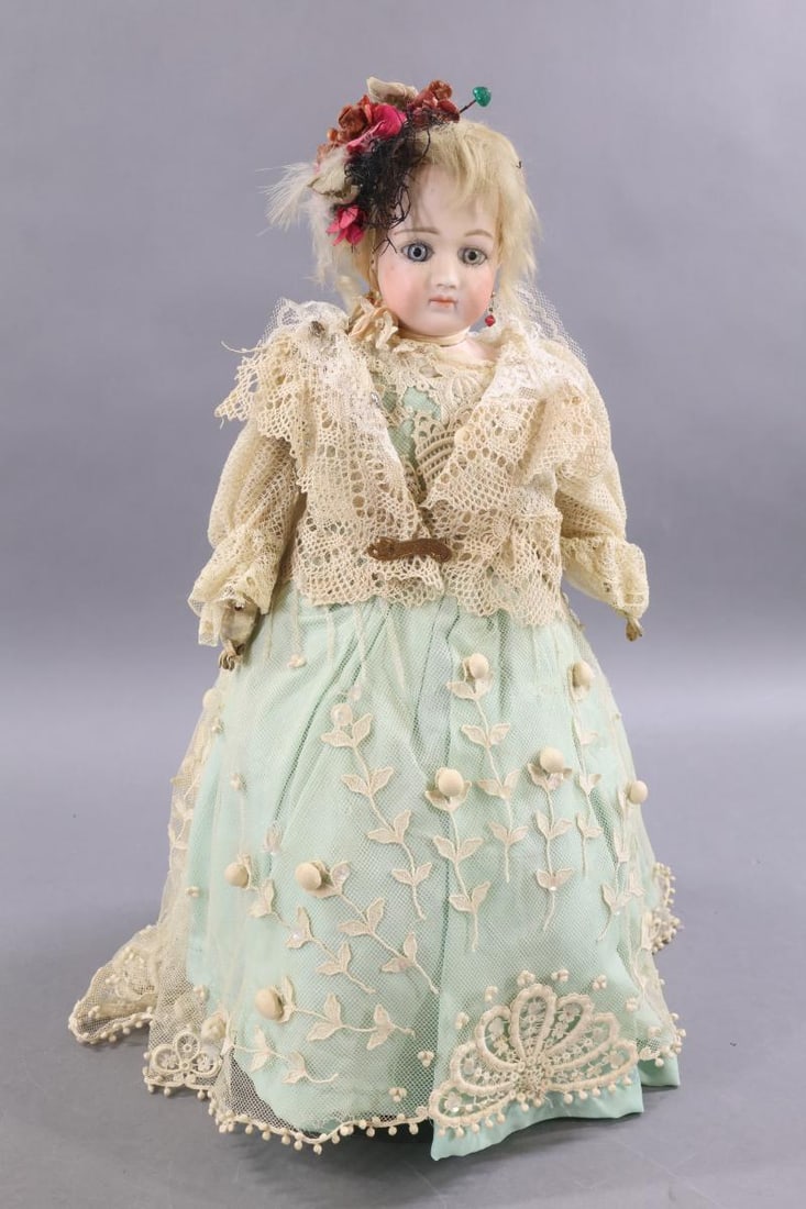 ANTIQUE FRENCH BISQUE FASHION DOLL.: 16" "5" French Fashion doll with swivel neck on separate shoulder plate. Stationary blue eyes, closed mouth, pierced ears, blonde mohair wig. Leather gusseted body, individual fingers. Dressed in