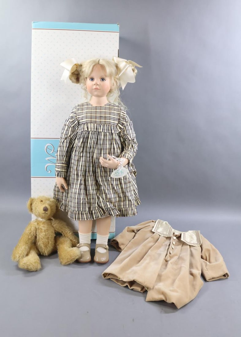 CONTEMPORARY ARTIST DOLLS.: 28" MIB 1997 HILDEGARD GUNZEL hard vinyl "Carinai" doll with her 12" tagged camel mohair Teddy Bear. Manufactured by WPM. Ltd. Ed. 250/500. COA. Stationary eyes, blonde HH wig. Dressed in plaid silk