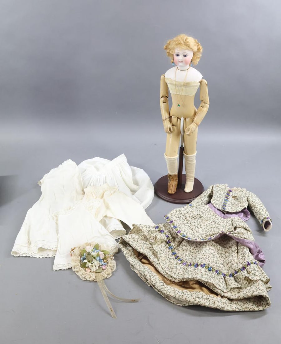 ANTIQUE FRENCH BISQUE FASHION DOLL.: 17" Unmarked French Fashion Doll with dark blue paperweight eyes, closed mouth, pierced ears, cork pate, replaced curly honey blonde mohair wig. Socket head mounted on a bisque shoulder plate. Fully