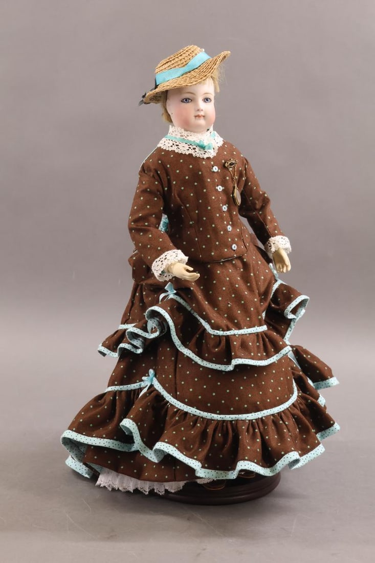 ANTIQUE FRENCH BISQUE FASHION DOLL.: 16" Unmarked French Fashion doll with blue paperweight eyes, closed mouth, pierced ears, cork pate, original honey blonde HH wig. Antique bisque head has been mounted on a reproduction bisque
