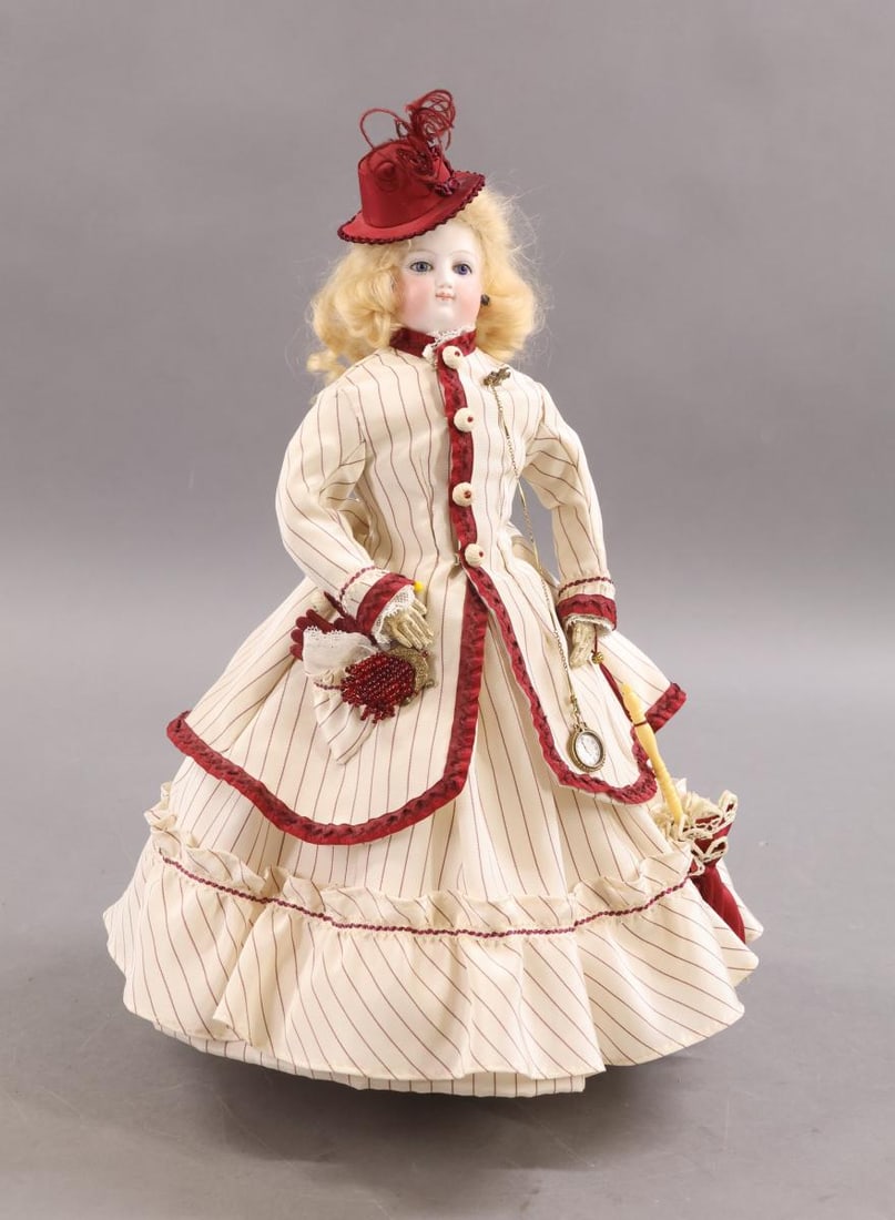 ANTIQUE FRENCH BISQUE FASHION DOLL.: 15" "E" French Fashion doll with blue paperweight eyes, closed mouth, pierced ears, replaced curly blonde mohair wig. Socket head is mounted on an antique parian shoulder plate. Gusseted white