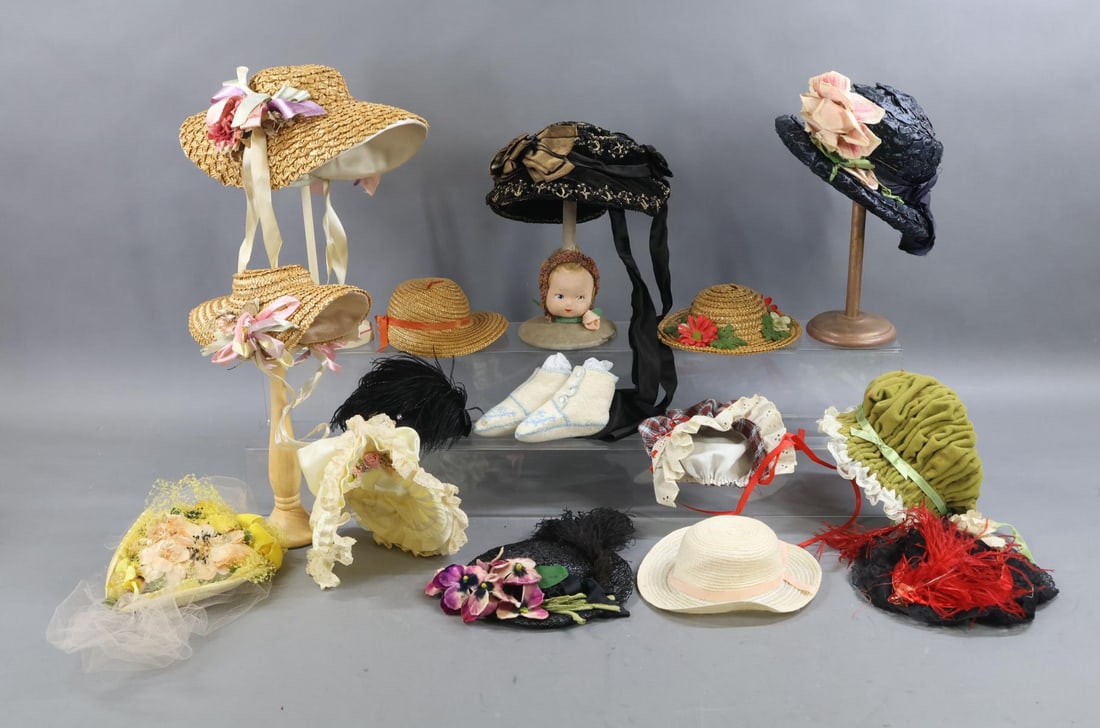 DOLL CLOTHING, ACCESSORIES.: LOT. Antique hat stand with cloth mask face head mounted on a velveteen base. (14) Hats of different sizes. Antique/vintage. Woven straw, velvet, beaded, lace, satin, cloth. Most are decorated.
