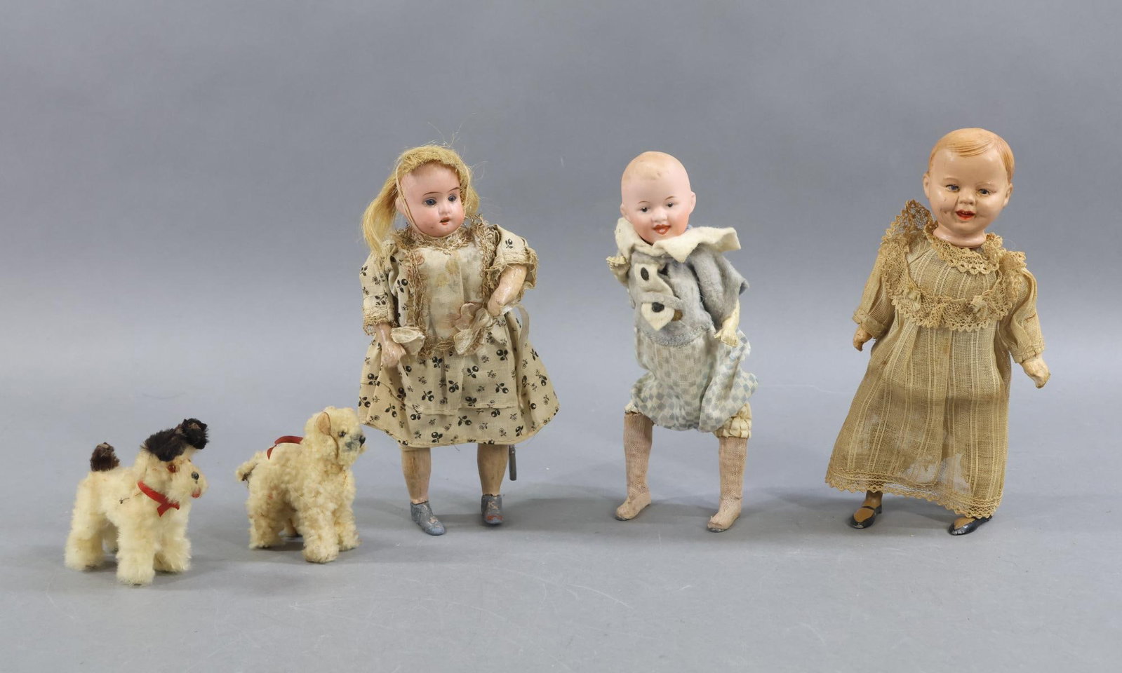 ANTIQUE TOYS.: LOT of (3) German "walking " dolls and (2) German fur animals. Dolls - all of these are key wound from the back and move from side to side when wound. They are factory dressed in antique cotton/felt