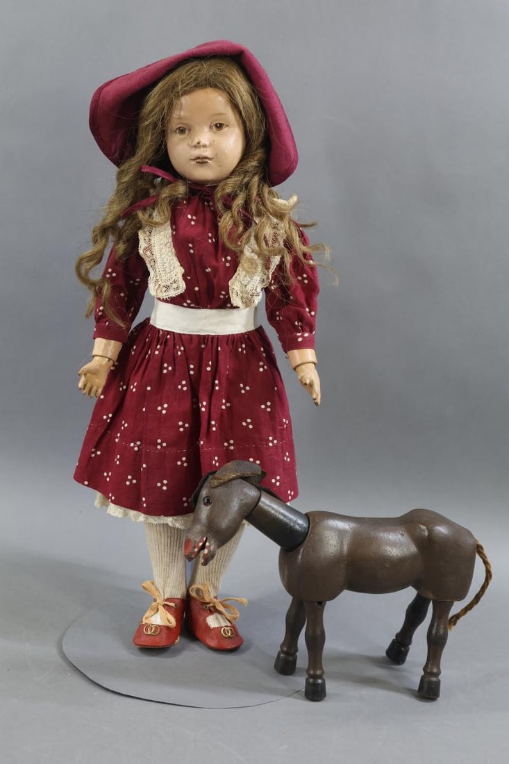 SCHOENHUT.: LOT. Schoenhut Doll - 19" Model No. 308, 1917 - 1924. Brown intaglio eyes, replaced long curly antique brown HH wig. Body has the incised mark on back of torso. No original clothing, she is dressed
