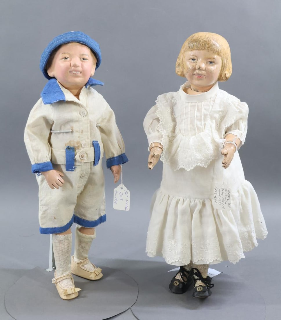 SCHOENHUT.: Pair of 16" Schoenhut dolls. Doll 1) Girl - Model No. 101, produced only May to November 1911. Designed by Graziano. Doll 2) Boy - Model No. 203 made from 1911 - 1916. Both carved head dolls have the