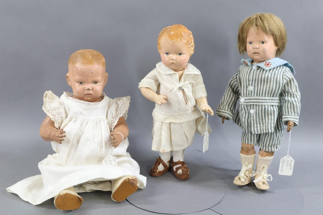 SCHOENHUT.: LOT of (3) Schoenhut dolls. (2) All wood Schoenhut Model No. 107 dolls. Both of these dolls original had a decal on the back of their torso or head. No original clothing. 14" "Toddler" with oval decal