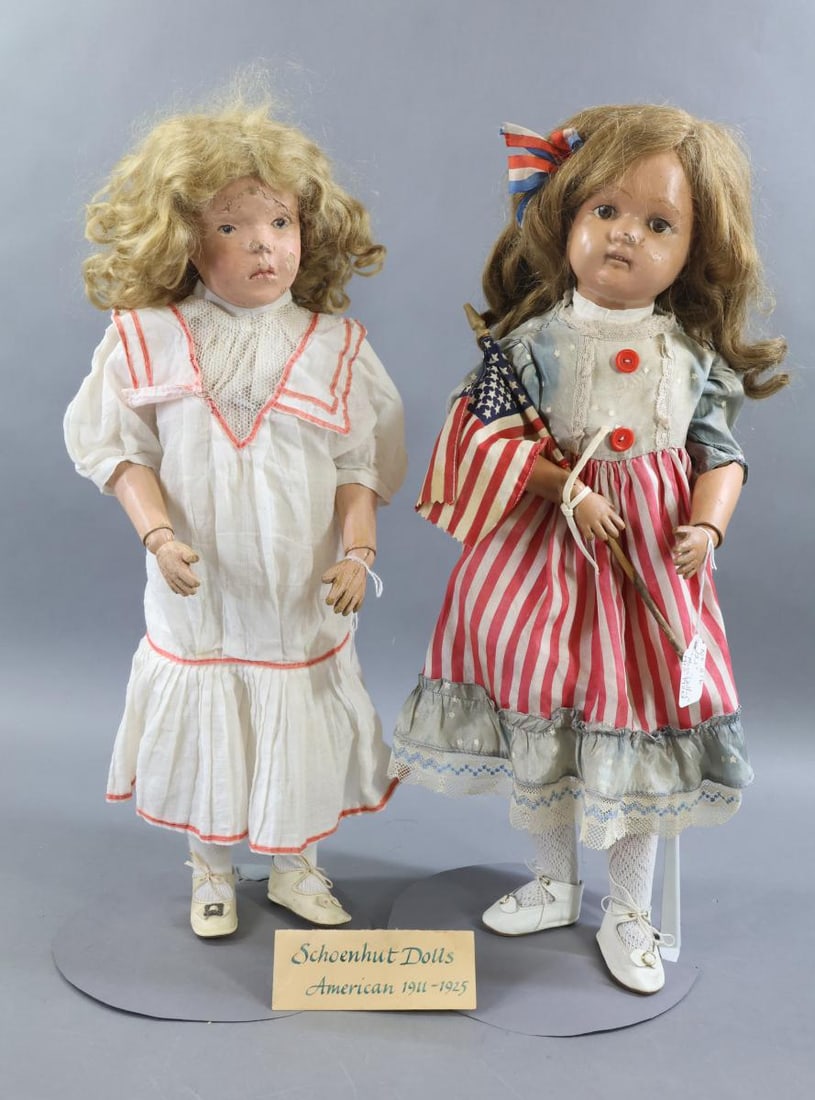 SCHOENHUT.: Pair of Schoenhut dolls. Both dolls shave replaced antique wigs. No original clothing, they have been redressed in antique/vintage clothing. Doll 1) 21" Model No. 405 made from 1912 - 1924. Incised ma