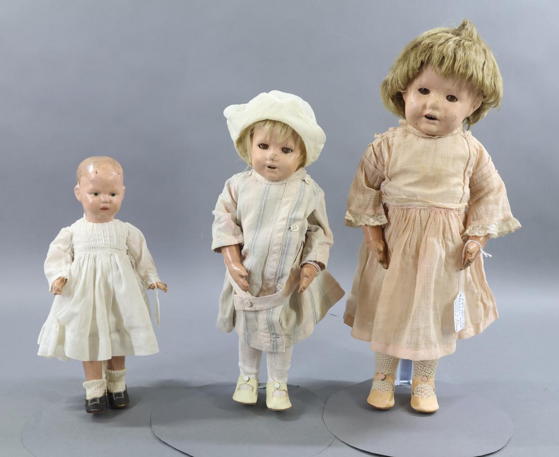 SCHOENHUT.: LOT of (3) "Walking" Schoenhut dolls. All of these dolls have the 5 pc. walking bodies. No original clothing, they have been redressed in antique cotton clothing, shoes. Doll 1) 11" Model No. 107W