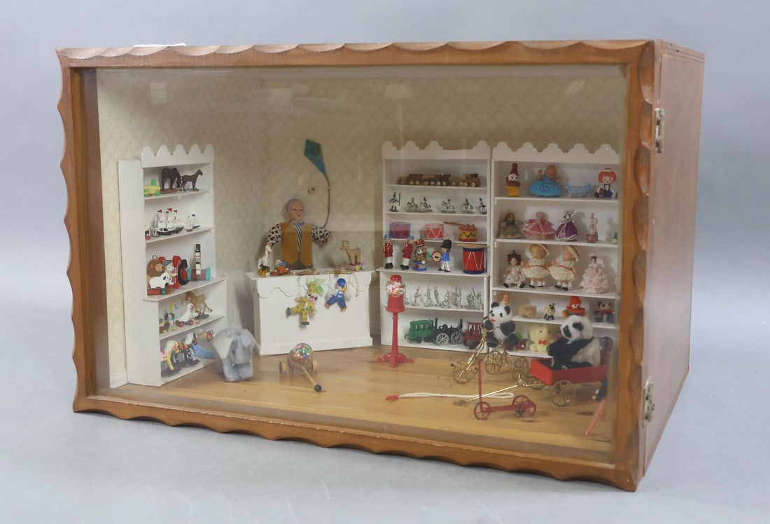 ROOM BOX.: TOY STORE Room Box. Contemporary scene of (3) shelving units full of toys. Dolls, bears, horses, soldiers, drums, pull toys, rocking horses, trains, ships, stuffed animals, bubble gum holder, chalk