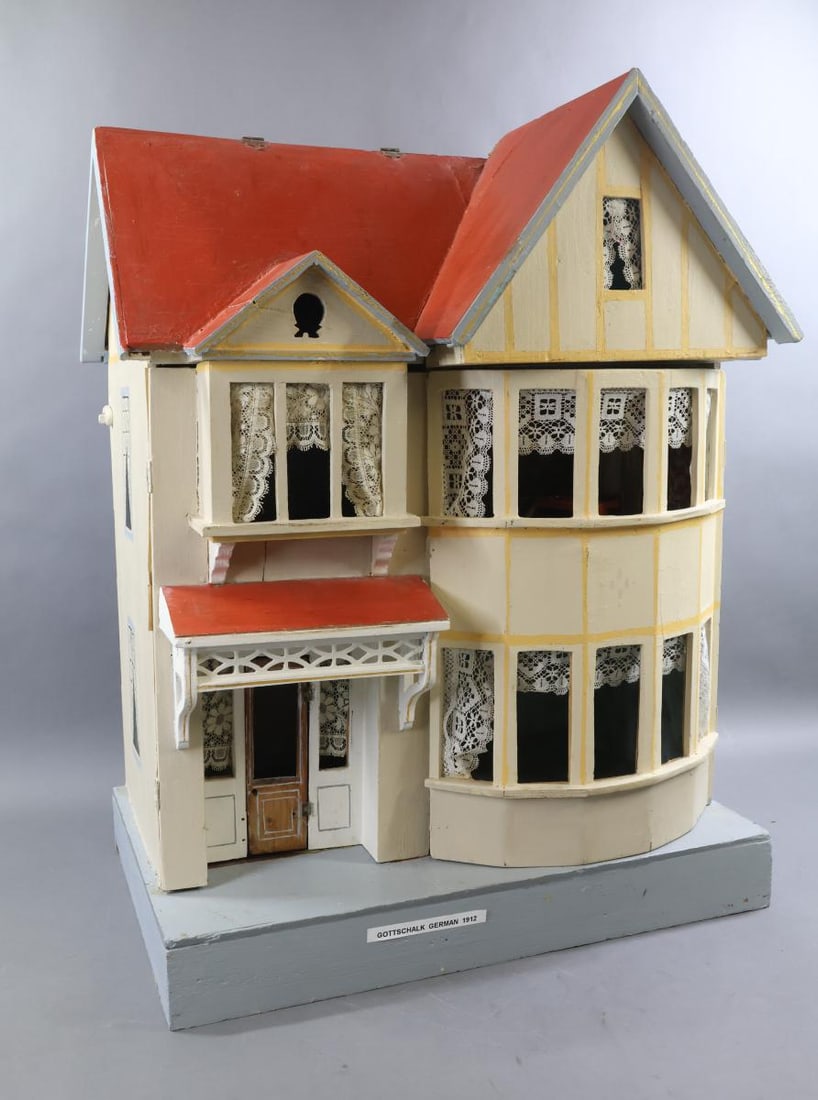 GOTTSCHALK DOLL HOUSE.: German GOTTSCHALK Red Roof House. Ca. 1912. Detachable chimney. Two story house with painted exterior. Painted side windows. Hinged right side with round bay or curved projection. Hinged left side wit