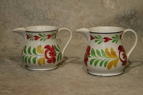 Two Adams Rose Creamers.: Decorated in green, red and yellow on white ground. 4" and 4 1/4" t. Condition: Both with hairline cracks.