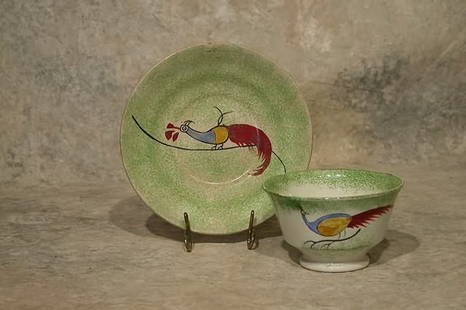 Spatterware Cup and Saucer.: Green spatterware with peafowl decoration. Saucer 5 3/4" dia., cup 2 1/2" t. Condition: Wear to rims.