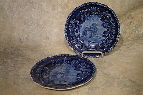 Two Staffordshire Plates.: Dark historical blue with landscape design, with foliate border. Impressed "Adams". 8 3/4" dia. Condition: One crazed.