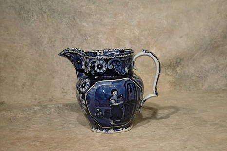 Clews Historical Blue Pitcher.: Dark blue transfer design depicts girl at well, with floral borders. 7 1/4" t. Condition: Restored spout.