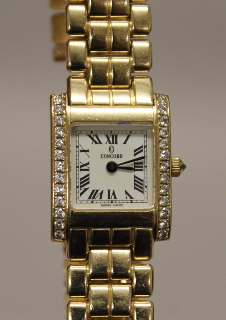 Ladies' Gold Concord Wrist Watch: 14KY with double deployant clasp. White dial with black Roman Numerals. Case #29-25-646 accented by (26) small round Diamonds, approx..52ctw. 30.2dwt.