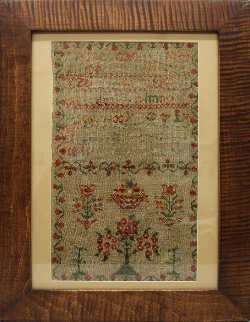 Sampler by Susan Allen Smith, 1841: Polychrome alphabet sampler with floral border and floral designs below text. 16.5"h x 10"w