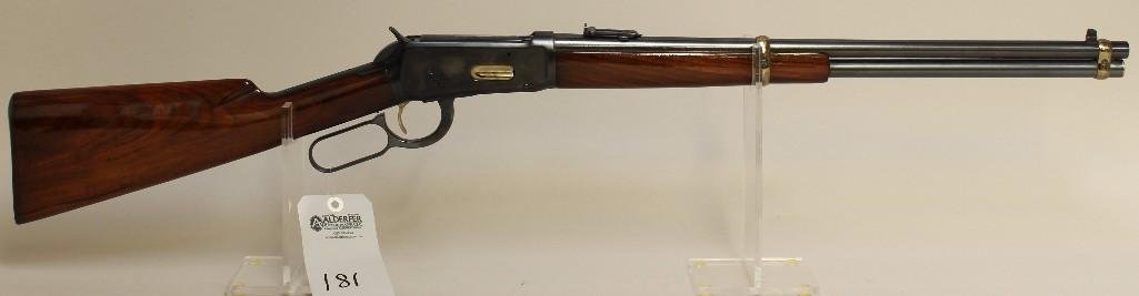 Winchester Model 94 lever action rifle.: Cal. 32 WS. 20" bbl. SN 968559. Reblued finish on metal, barrel bands, loading port and trigger are gold in color, extractor is jeweled, bore is dirty and unable to tell if pitted, saddle ring, 1