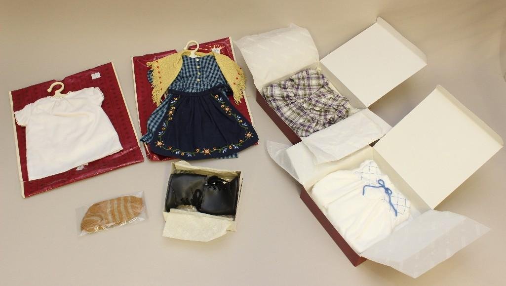 AMERICAN GIRL - LOT OF MIB/MIP "KIRSTEN" OUTFITS: ITEMS FROM HER COLLECTIONS: NIGHTGOWN; TEDDY/PETTICOAT; CHECKED DRESS & APRON: BLACK BOOTS & (3) PAIRS OF SOCKS; PLAID DRESS & SHAWL.