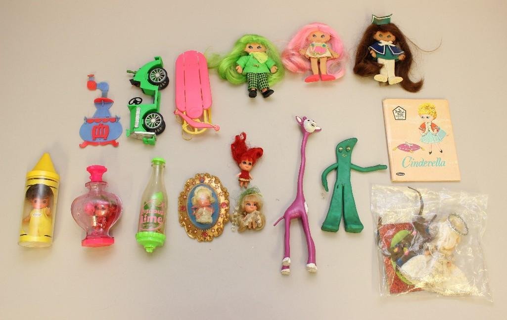 LOT OF FLATSIES, LITTLE KIDDLES, GUMBY AND OTHER ITEMS.: (3) Flatsies - lime green, hot pink and brunette hair colors. Dolls are fuly dressed and come with a stove, green automobile and pink sled. Condition: melt damage on vehicles. Little Kiddles - Kiddle