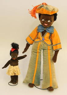 PAIR OF ALL ORIGINAL ENGLISH TAGGED BLACK VELVETEEN: 7" NORAH WELLINGS ISLAND GIRL AND 14 1/2" FARNELL'S ALPHA TOYS MALE. Both dolls have painted side glance eye, black mohair wigs. 7" Doll - is wearing a grass hula skirt. 14 1/2&quo