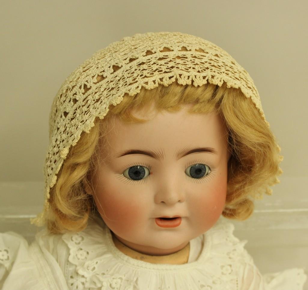 22" ABG 1361 50 MADE IN GERMANY 15 ANTIQUE BISQUE HEAD: Blue sleep eyes, open mouth with woggle tongue, pierced nostrils, strawberry blonde mohair wig. 5 Pc. papier mache bent limb baby body. Dressed in antique baby clothing: long christening gown, long pe
