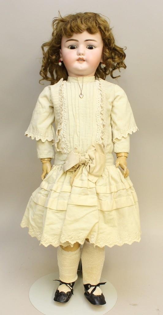 30 1/2" S&H 1079-DEP 15 GERMANY ANTIQUE BISQUE HEAD: Brown sleep eyes, open mouth, pierced ears, original brown mohair wig, plaster pate. Papier mache ball jointed body. Dressed in all antique white clothing: wool drop wasit dress with embroidery and tu