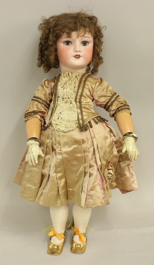 28" 1926 FRANCE S.F.B.J. 301 13 (RED STAMP) TETE: Blue sleep eyes, open mouth, pierced ears, original very curly brown human hair wig. Unmarked papier mache jointed body with separate hands. Dressed in all antique clothing: heavy pink silk satin 2 pc
