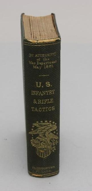 Civil War Infantry Tactics Book: Book titled "U.S. Infantry Tactics" by JB Lippencott & Co., Philadelphia 1862. Interior cover of book features ink name "Wm. P. Lyon" Book exhibits some wear with tearing and d