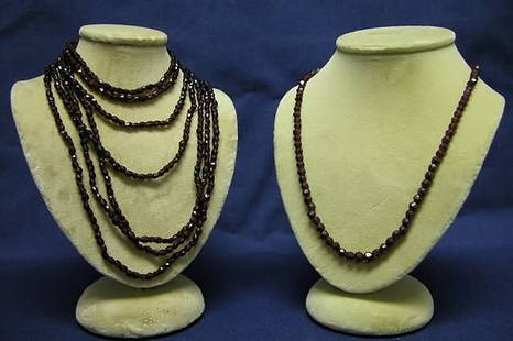 Two Garnet Necklaces.: One 44" double strand, the other 17" single strand of 3 1/2mm beads.