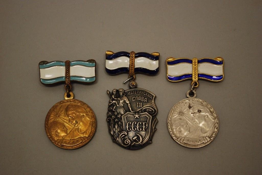 Group of Soviet Mother's Medals: Group of Soviet medals related to motherhood including; 1.) Maternity Medal, 1st class 2,) Maternity Medal, 2nd class 3.) Order of Maternal Glory, 3rd class (jump ring missing with temporary replaceme