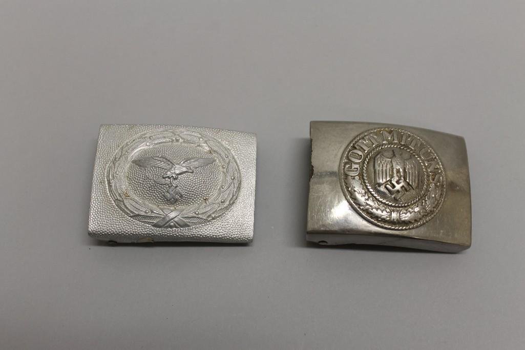 German WW II belt buckles.: German WW II belt buckles. Lot consists of a standard enlisted ranks Army "Gott mit Uns" buckle displaying an old nickel finish and a pebbled faced stamped aluminum Luftwaffe enlisted mans b