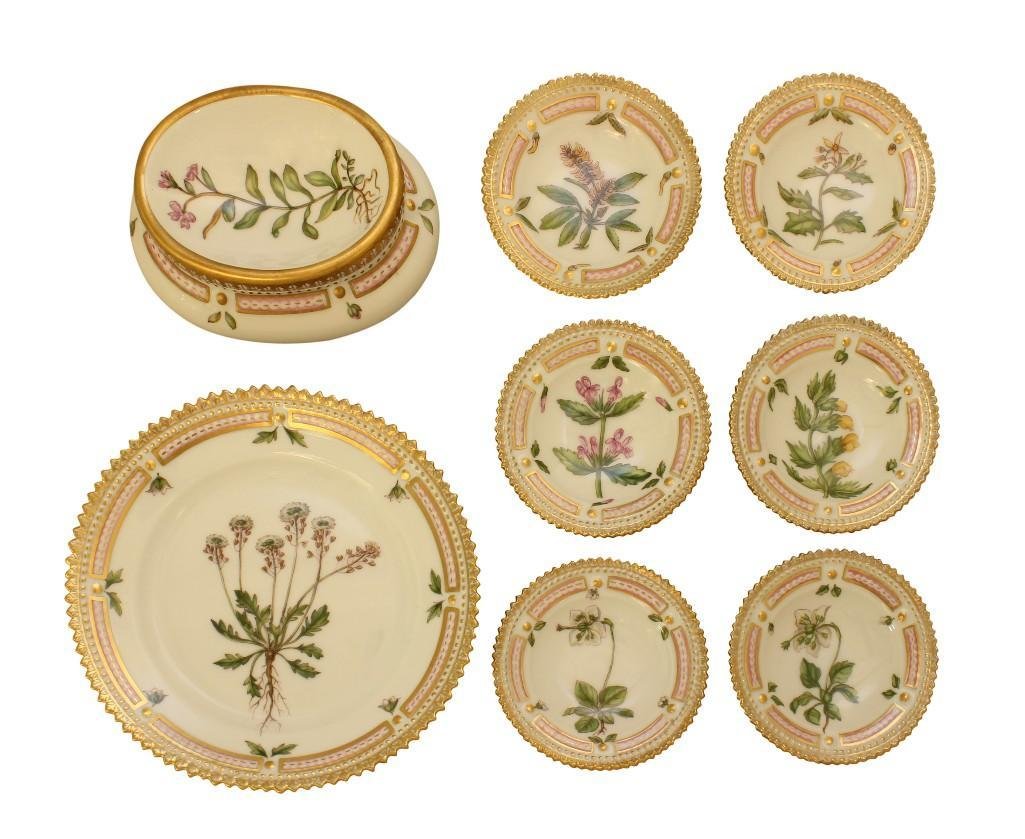 Royal Copenhagen "Flora Danica" Porcelain Grouping: Grouping includes six butter pats, a 5.75" diameter plate (all with serrated rims) and a salt cellar. Each piece is marked with the green crown and blue waves.