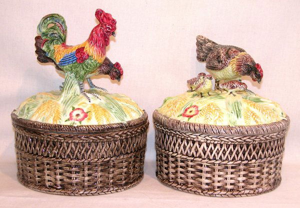 Pair of Majolica Hen Dishes.: Pair of majolica covered dishes with basket-design bases, one lid with a rooster and hen, 10"t., the other with a hen and chicks, 8"t., both 7 1/2"dia., no maker's mark. Condition: glazed-over chip on