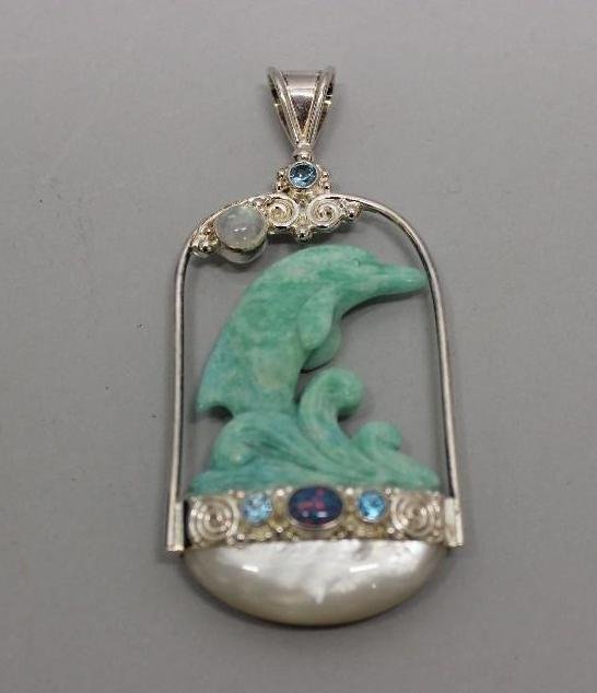 Porpoise Pendant: Carved Amazonite Porpoise with Mother of Pearl, Blue Topaz, Moonstone and Opal. Sajen Sterling. 34.0gtw.