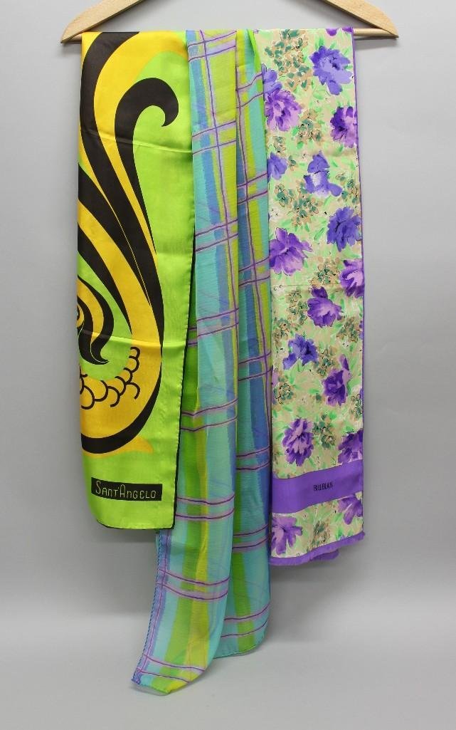 Grouping of 3 Rectangular Silk Scarves: Grouping includes a Bill Blass scarf with floral motif in purple and green (10.5" x 55.5"), a Sant'Angelo scarf with an abstract fish design in yellow, brown, and green (11" x 40&q