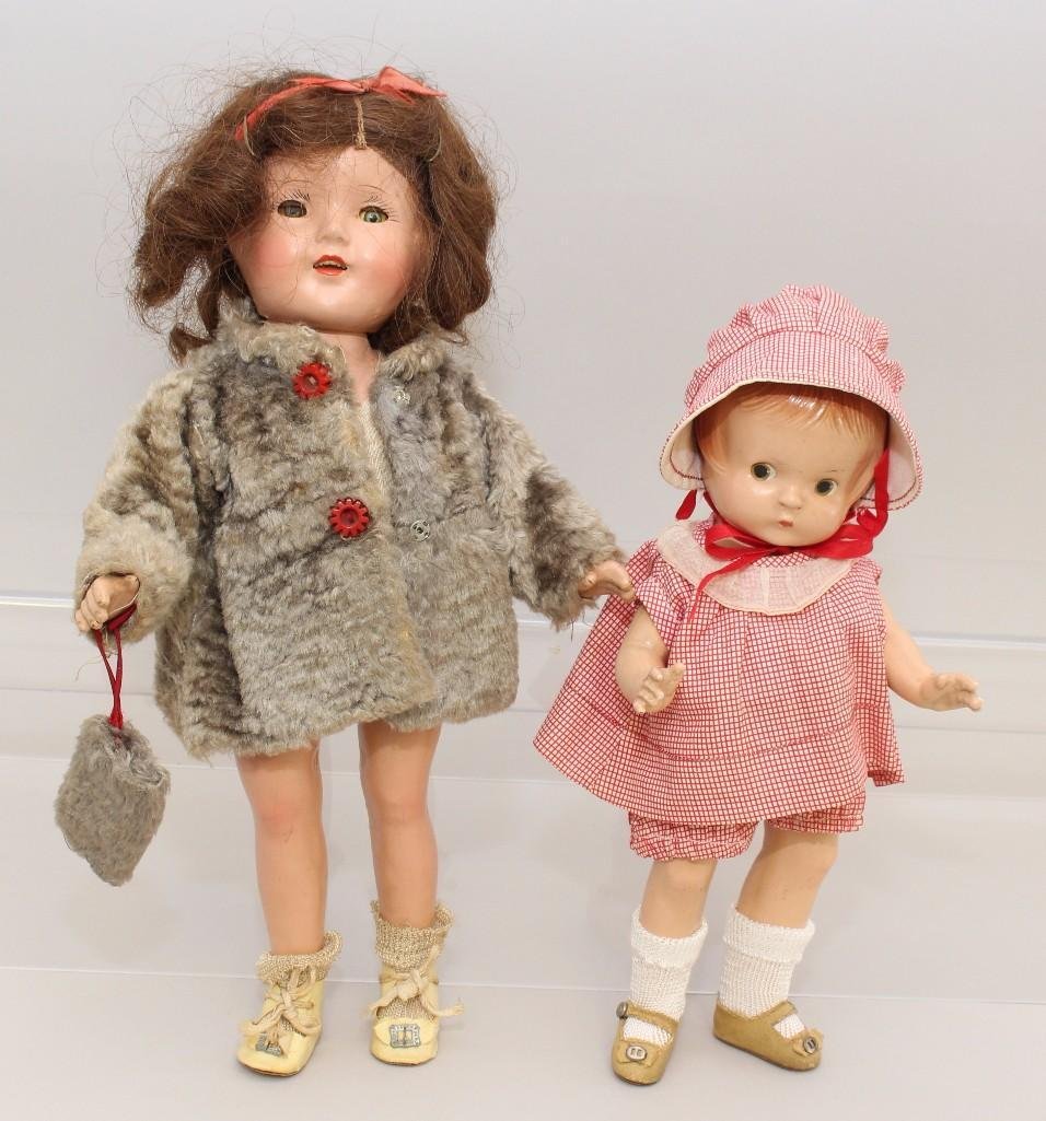 PAIR OF COMPOSITION DOLLS: 11" PATSY JR. & 14": 11" Effanbee Patsy Jr. doll with painted brown eyes, red hair. Factory original 3 pc. outfit and oilcloth shoes. Newer socks. Condition: crazing, rubs on face. 14" Unmarked child doll with (